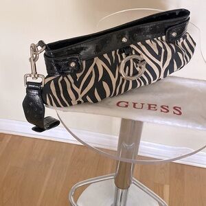 Guess brand clutch w/ dust bag. Zebra 🦓, good condition, all zips in  tact.
